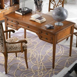 Dettaglio scrittoio in legno con cassetti e decorazioni