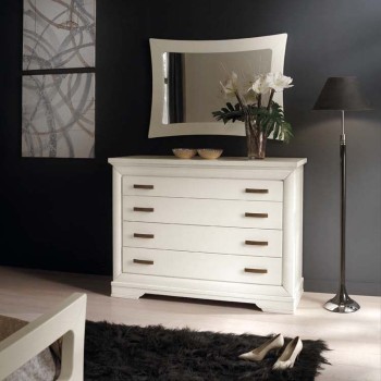 Comò quattro cassetti in ambiente moderno con cornice