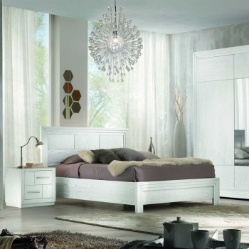 Letto con testata legno in una camera elegante