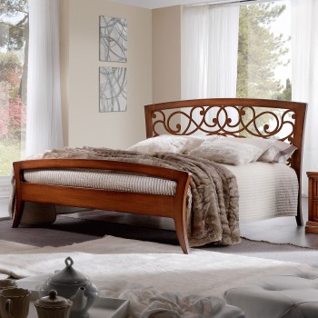 Letto con testata legno traforata in noce tanganica