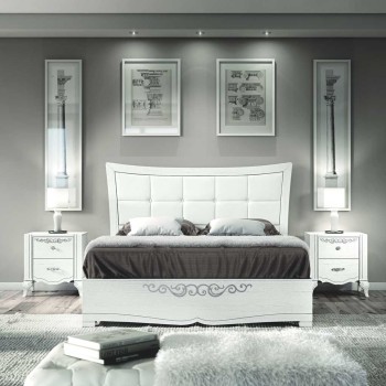 Letto sagomato con testata imbottita e decorazioni floreali