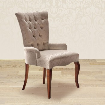 Poltroncina capitonnè dettaglio tessuto e gambe in legno