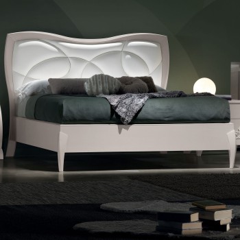 Letto matrimoniale sagomato con imbottitura e testata illuminata