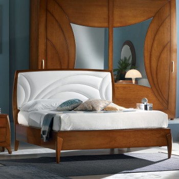 Letto matrimoniale curvo con testata imbottita in ecopelle