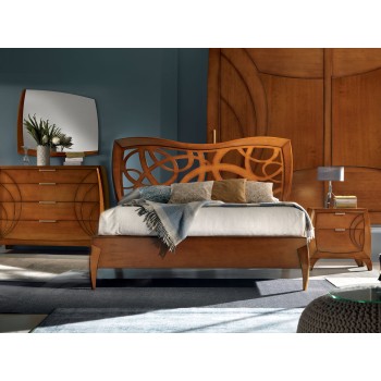 Camera da letto contemporanea con testiera intagliata