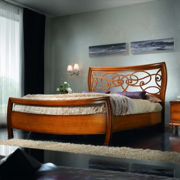 Letto due piazze testata traforata in legno noce